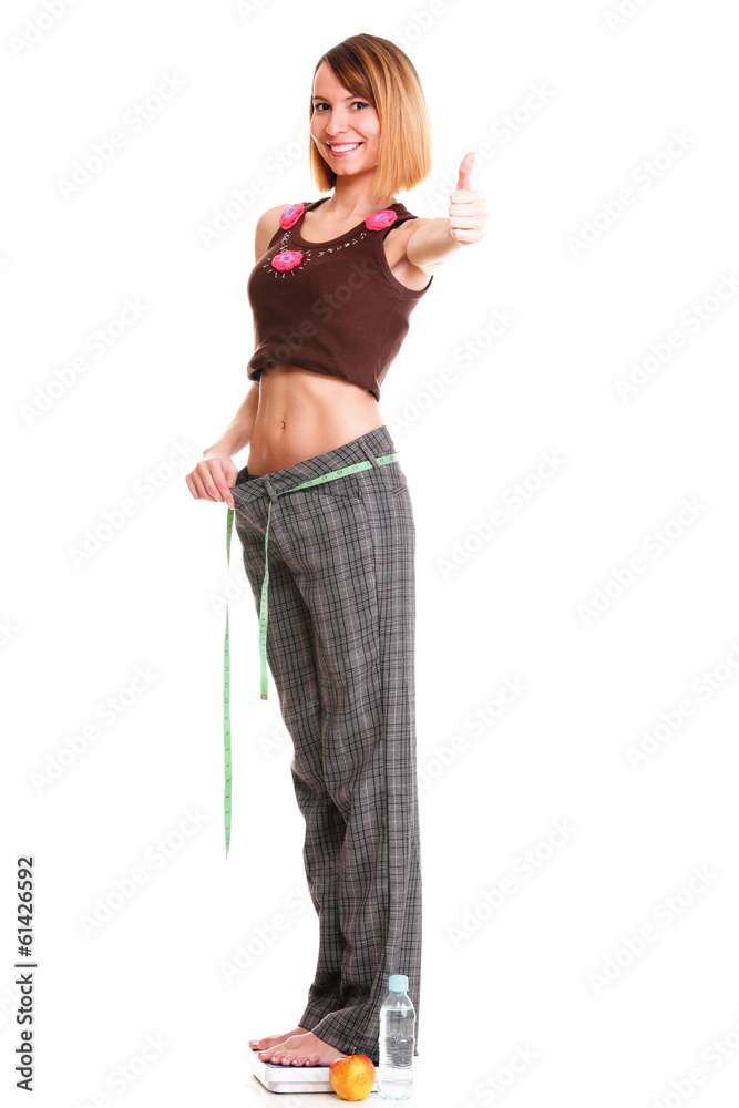 Pretty woman shows her weight loss wearing measure tapes isolate Pretty woman shows her weight loss wearing measure tapes isolate