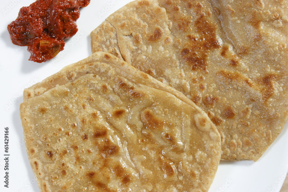 A paratha (or parantha) is a flatbread that originated in India