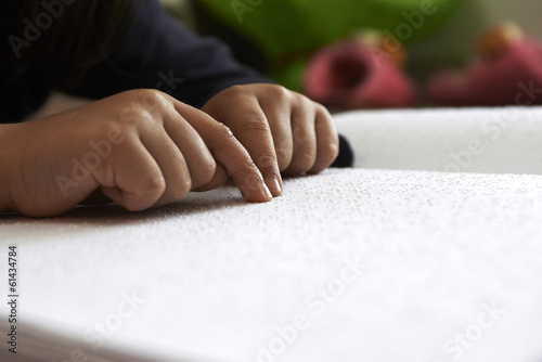 blind children read text in braille