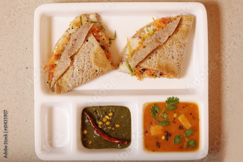 Ragi Dosa is a fermented crepe or pancake made from Ragi batter photo