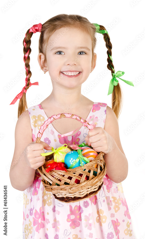 Smiling little girl with basket full of colorful easter eggs iso