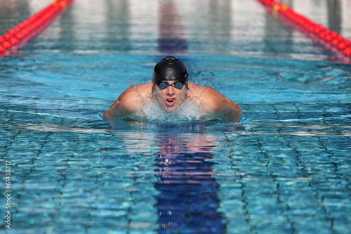 Professional swimmer in swimming pool taking breath © endostock
