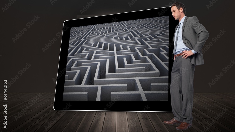 Composite image of serious businessman with hands on hips Composite image of serious businessman with hands on hips