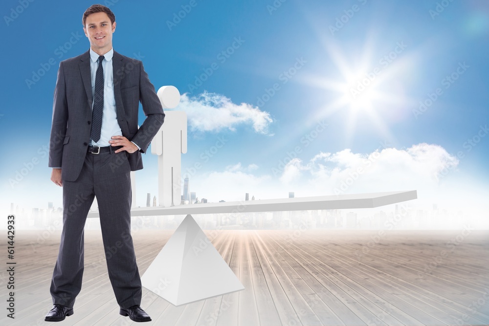 Obraz premium Composite image of smiling businessman with hand on hip