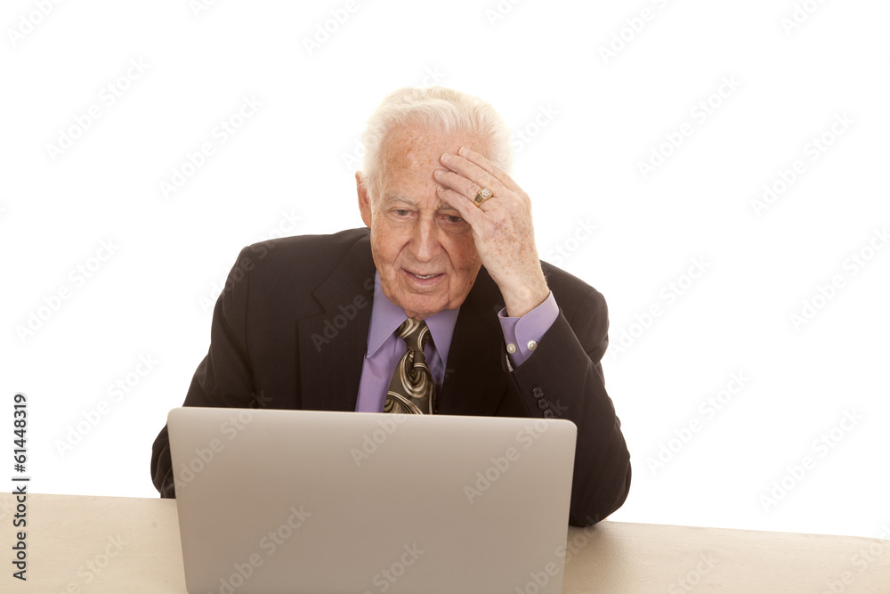 Elderly man business computer hand on head Elderly man business computer hand on head