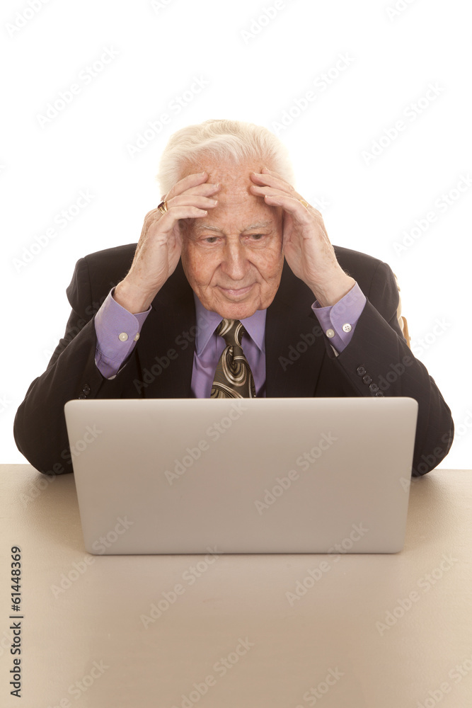 Elderly man business computer hands on forehead Elderly man business computer hands on forehead