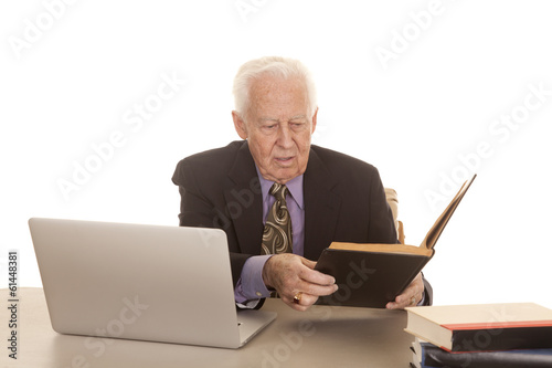 Elderly man business computer look at book © Poulsons Photography