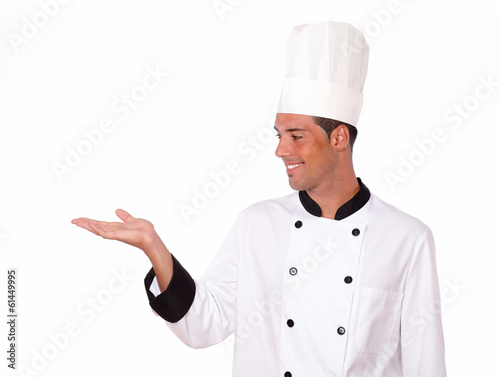 Latin chef holding up his right hand