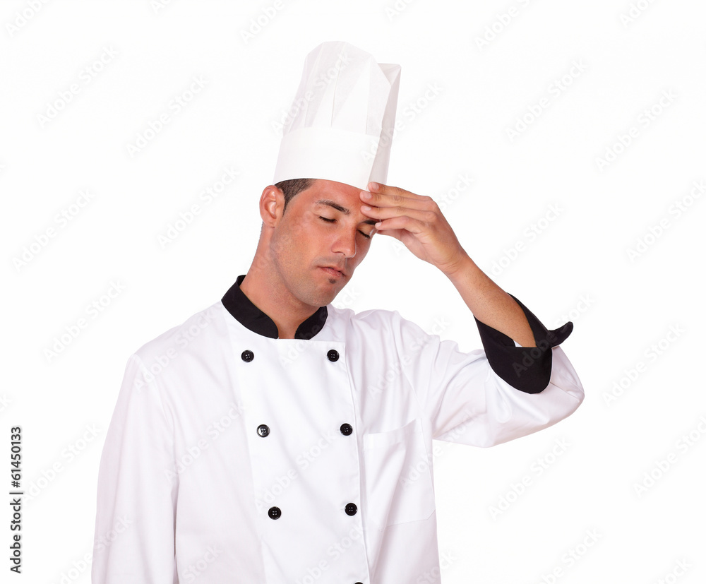 Professional young male chef with headache Professional young male chef with headache