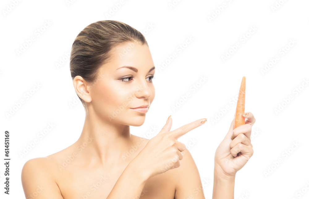 A beautiful and sensual girl eating carrot on white A beautiful and sensual girl eating carrot on white