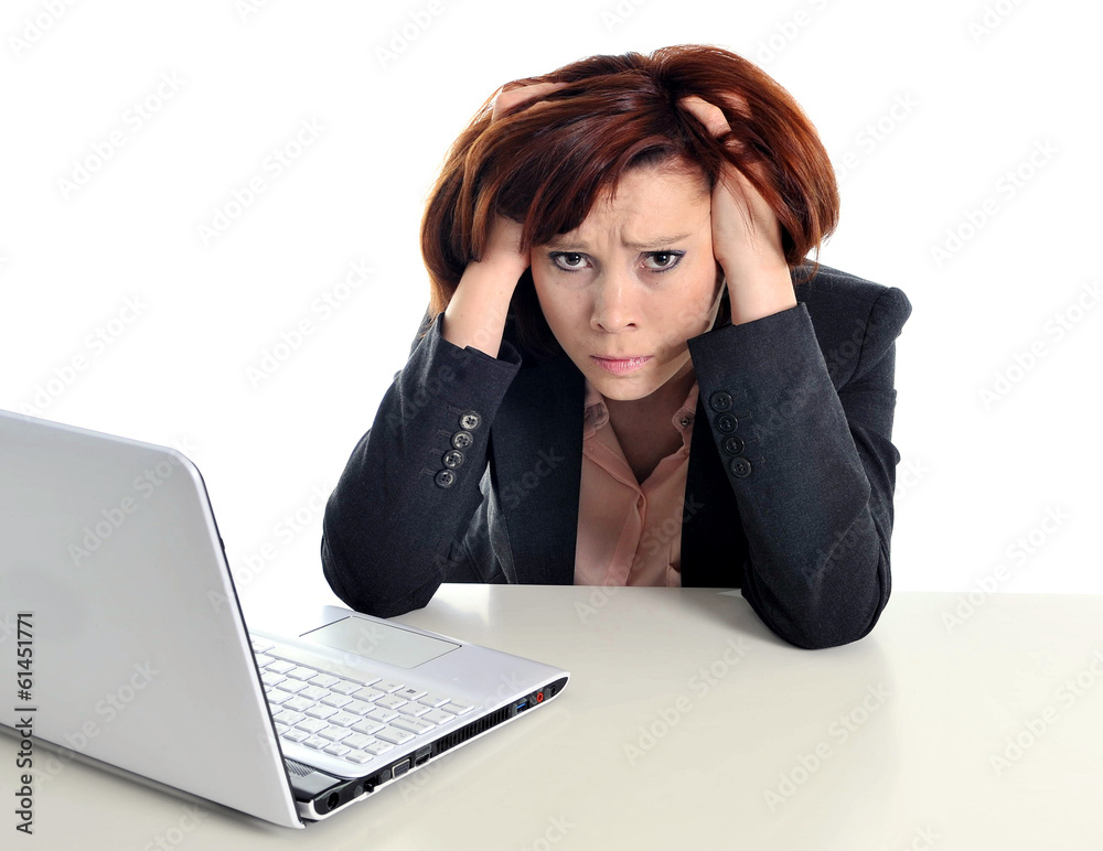 sad business red haired woman in stress at work with computer sad business red haired woman in stress at work with computer