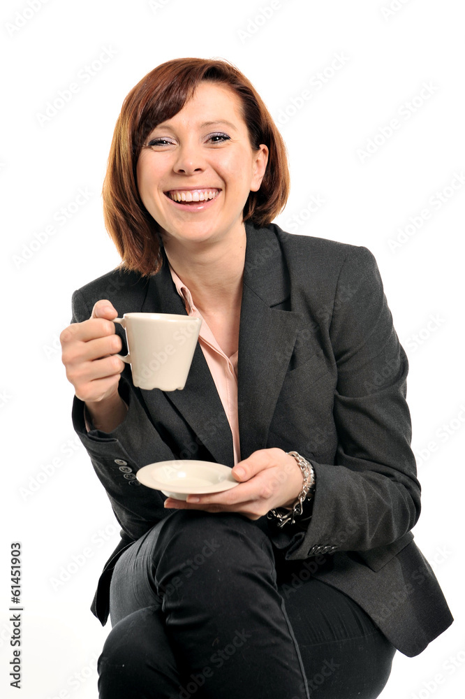 Happy business woman with red hair drinking coffee and smiling Happy business woman with red hair drinking coffee and smiling