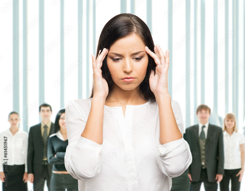 A tired and upset businesswoman in a stressful situation A tired and upset businesswoman in a stressful situation