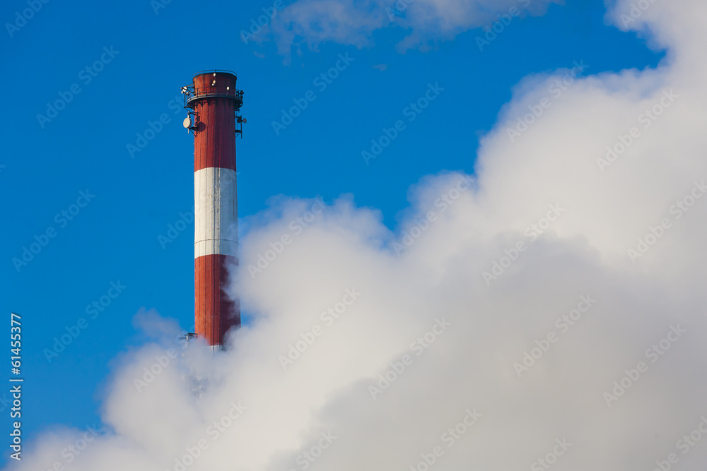 Chimneys with clouds of smoke, pollution on the environment.