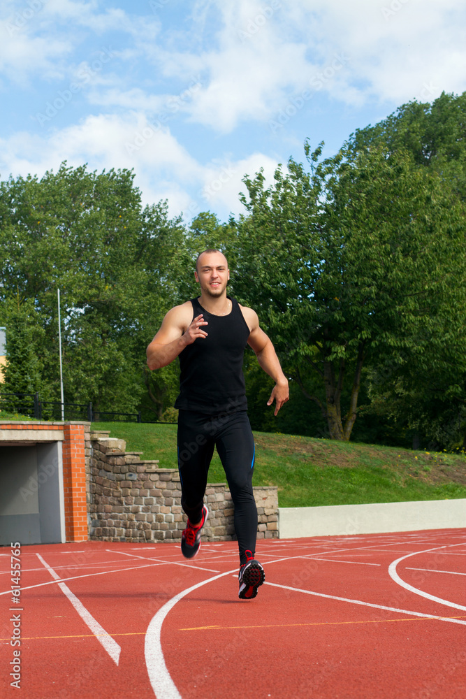 Obraz premium Image of muscle man running on stadium