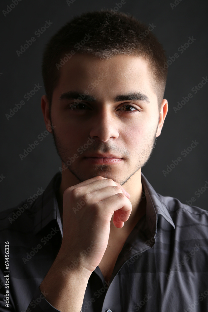 Handsome young man on dark background Handsome young man on dark background