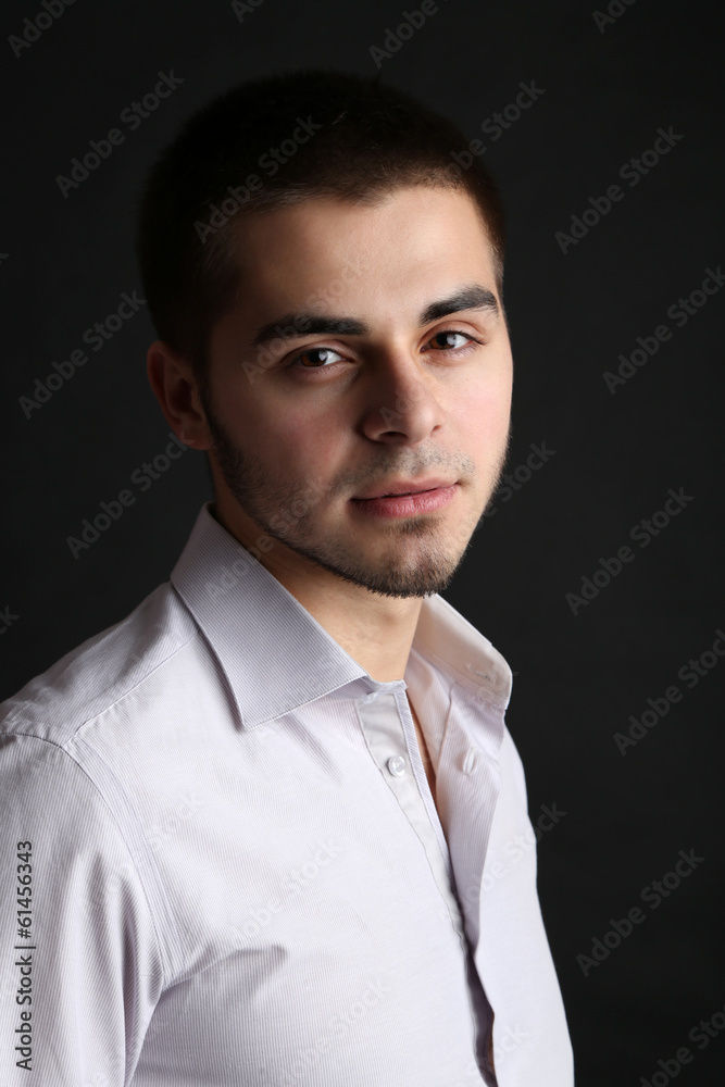 Obraz premium Handsome young man on dark background