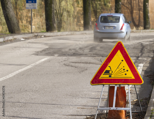 car on broken road, signal photo