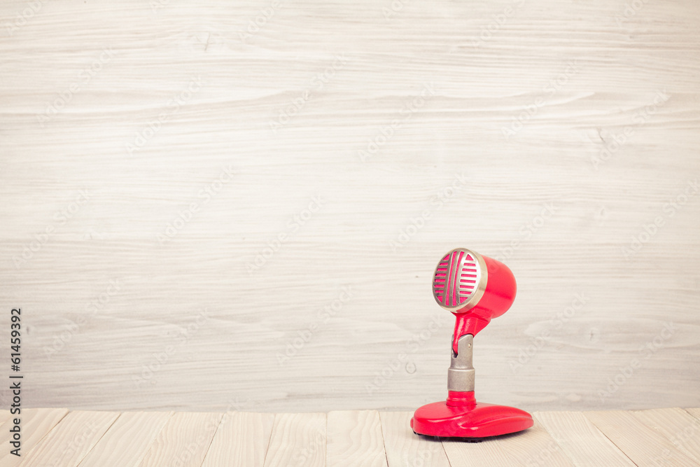Retro red microphone on table Retro red microphone on table