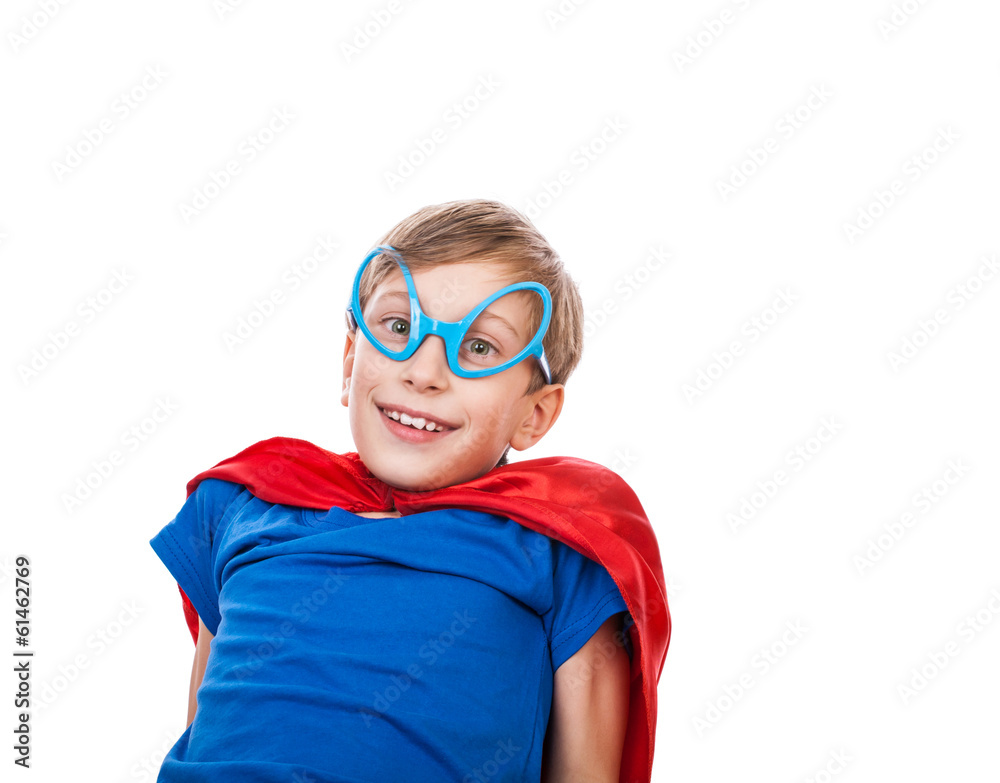 Beautiful happy child superhero resting on the floor Beautiful happy child superhero resting on the floor