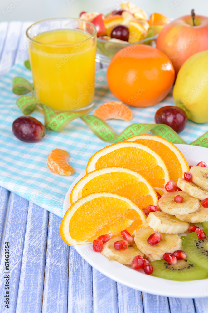 Sweet fresh fruits on plate on table close-up Sweet fresh fruits on plate on table close-up