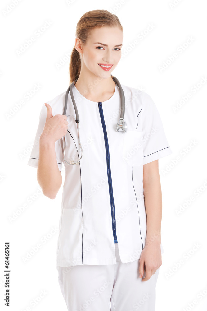 Beautiful caucaisn nurse or doctor showing ok gesture. Beautiful caucaisn nurse or doctor showing ok gesture.