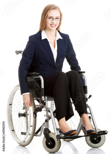 Beautiful caucasain business woman sitting on wheelchair.