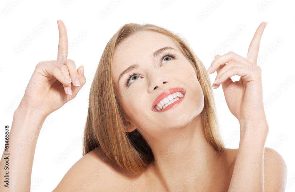 Beautiful caucasian topless woman pointing up. Beautiful caucasian topless woman pointing up.