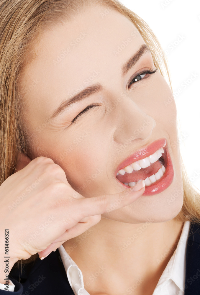 Beautiful caucasian business woman is showing sign to call her. Beautiful caucasian business woman is showing sign to call her.