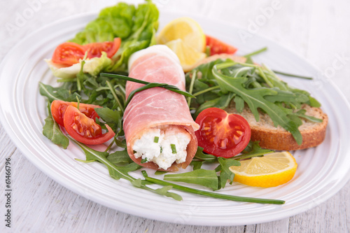 vegetable salad and ham rolled with cheese
