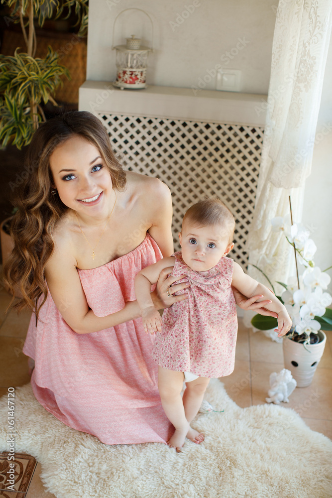 Portrait of a young mother and little daughter Portrait of a young mother and little daughter