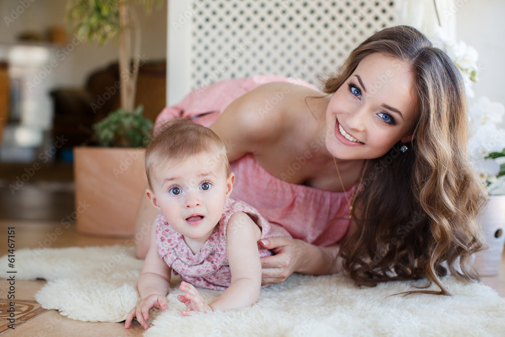 Portrait of a young mother and little daughter Portrait of a young mother and little daughter