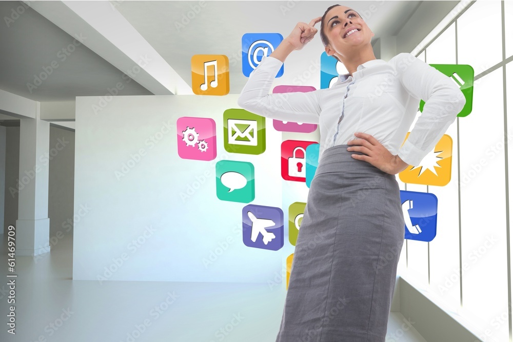 Fototapeta premium Composite image of smiling thoughtful businesswoman