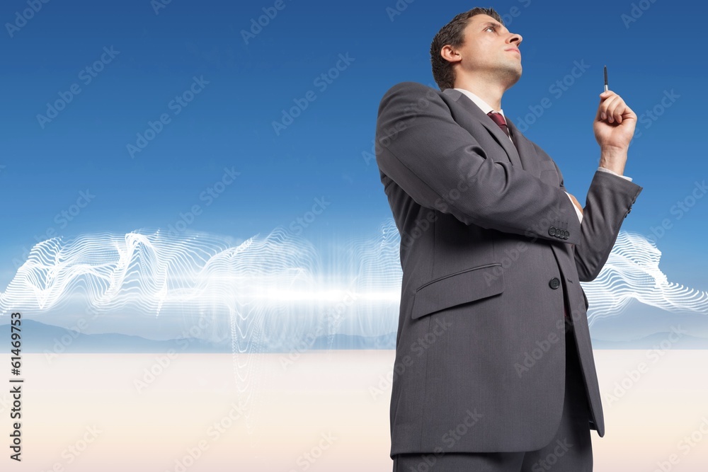 Composite image of thoughtful businessman holding pen Composite image of thoughtful businessman holding pen