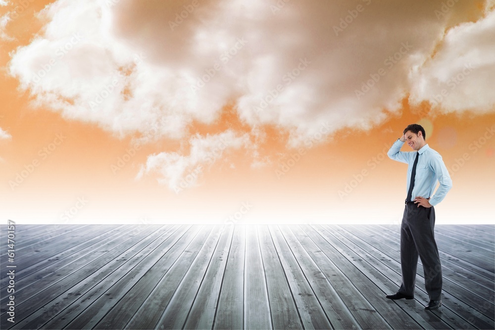 Composite image of thoughtful businessman with hand on head Composite image of thoughtful businessman with hand on head