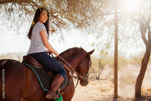 Riding a horse on a sunny day © AntonioDiaz