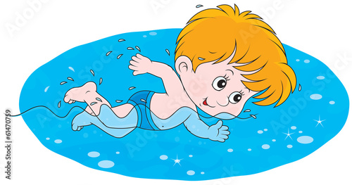 Little boy swims in blue water