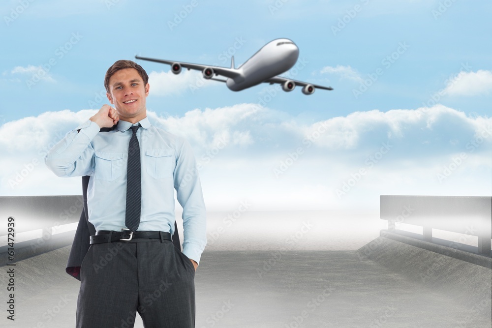 Composite image of smiling businessman holding his jacket Composite image of smiling businessman holding his jacket