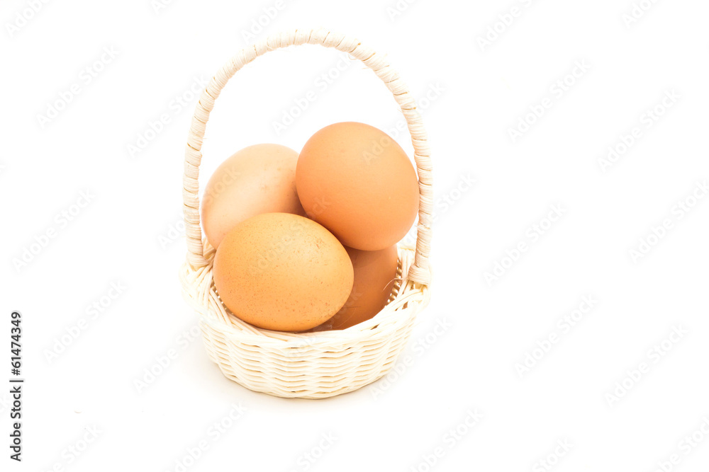 brown eggs in basket on a white background brown eggs in basket on a white background
