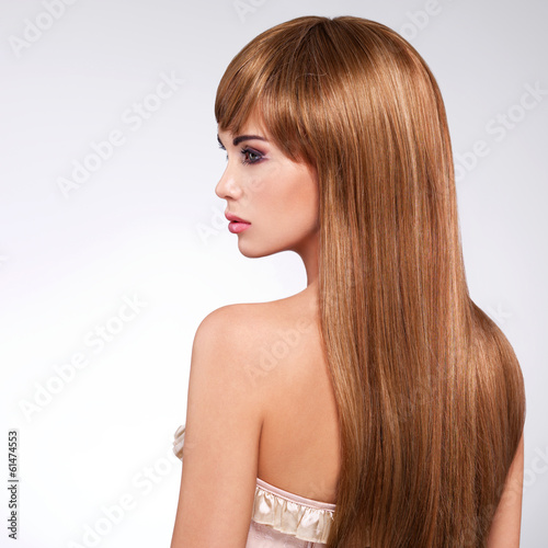 Profile portrait of the woman with long hair.