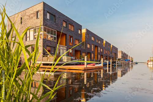 Row of Dutch modern canal houses in Almere photo