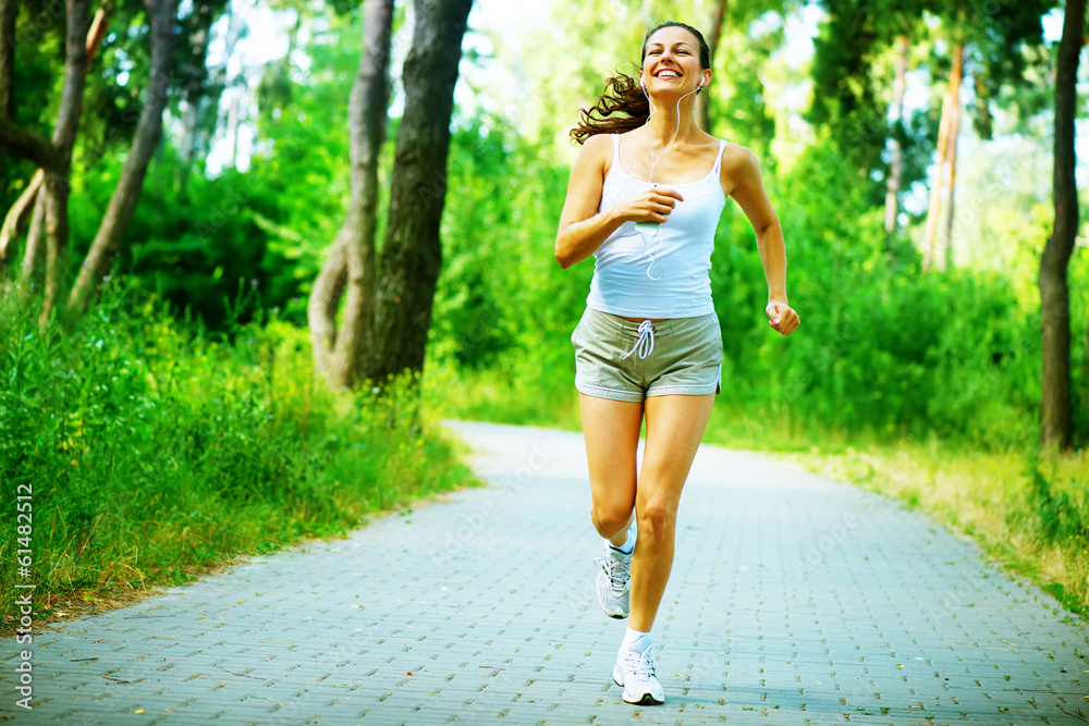 Running Woman. Outdoor Workout in a Park. Full Length Portrait Running Woman. Outdoor Workout in a Park. Full Length Portrait