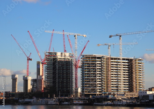 View of construction area with cranes near waterfront © chrisrt