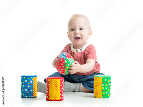 little kid playing with bui...