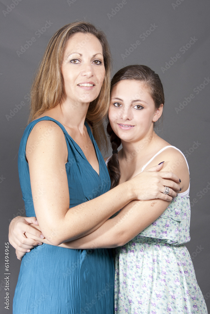 Young Mom hugging her Beautiful Teenage Daughter