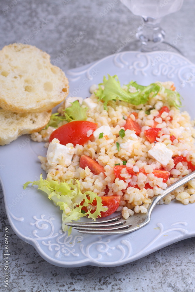 salad with tomatoes, feta cheese, grits and green salad with tomatoes, feta cheese, grits and green