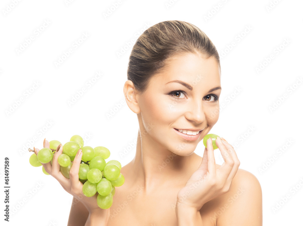 Close-up portrait of a beautiful and sensual girl eating grapes Close-up portrait of a beautiful and sensual girl eating grapes
