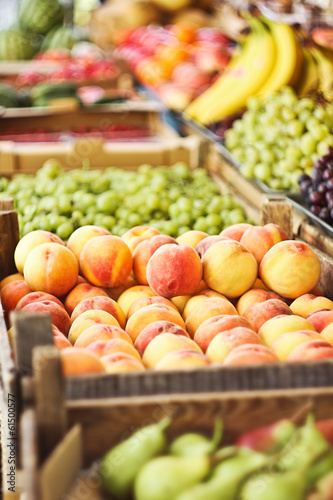 Various fresh fruits in boxes on the market