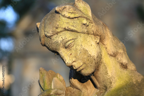 Stone Girl on Tomb from old Prague Cemetery  Czech Republic