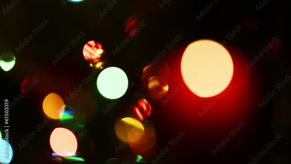 burning candle on background of holiday lights - changing focus burning candle on background of holiday lights - changing focus
